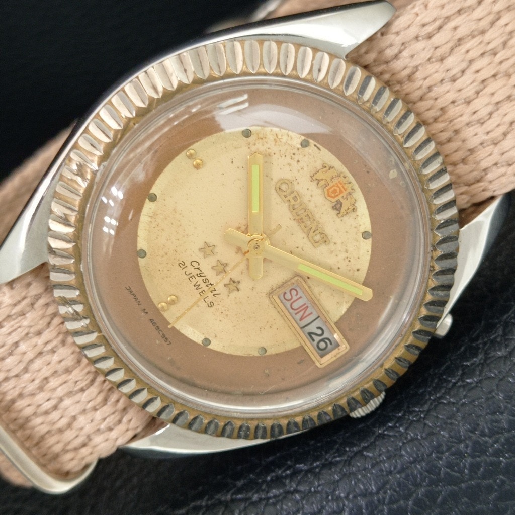 Vintage 1975 Orient Automatic Mens Silver Watch WDaydate  Gold Accents